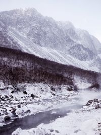 Scenic view of snow covered mountains