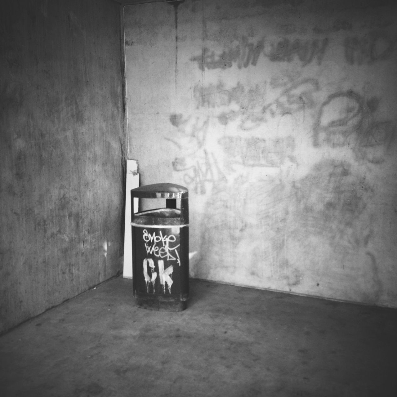 text, indoors, wall - building feature, communication, western script, wall, abandoned, built structure, no people, architecture, absence, illuminated, old, empty, graffiti, transportation, day, damaged, non-western script, obsolete