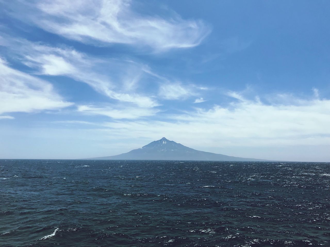 sky, scenics - nature, cloud - sky, beauty in nature, mountain, tranquil scene, sea, tranquility, volcano, non-urban scene, water, land, no people, idyllic, day, nature, travel destinations, outdoors, waterfront, horizon over water, mountain peak, volcanic crater