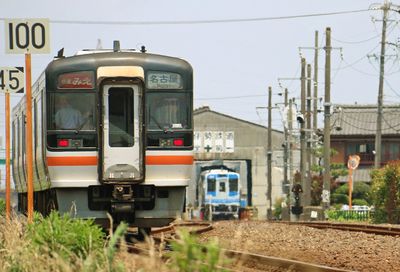 Train at railroad station against sky