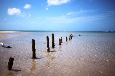 Scenic view of sea against cloudy sky