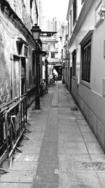 Empty alley along buildings
