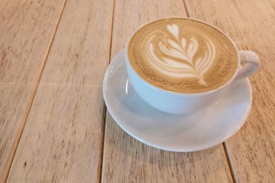 High angle view of cappuccino on table