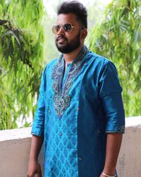 Portrait of young man wearing sunglasses standing outdoors