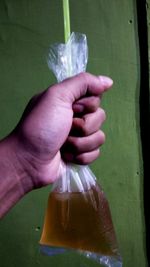 Close-up of human hand holding drink