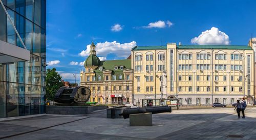 Buildings in city against sky