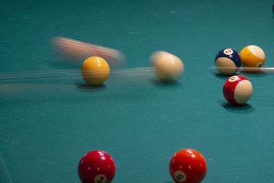 Close-up of multi colored balls on table