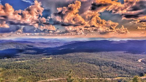 Scenic view of landscape against dramatic sky