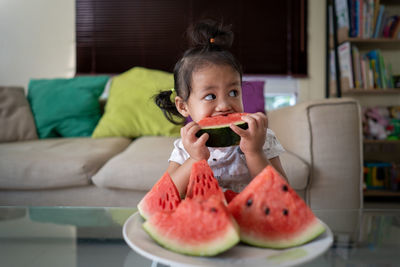 Portrait of girl eating watermelon 