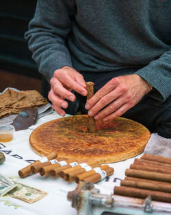 Midsection of man preparing food