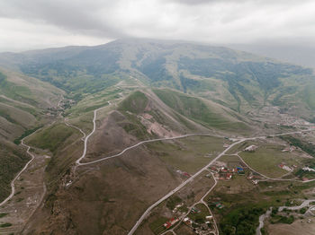 High angle view of road amidst mountains against sky