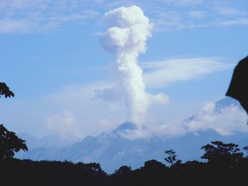 Low angle view of vapor trail against blue sky