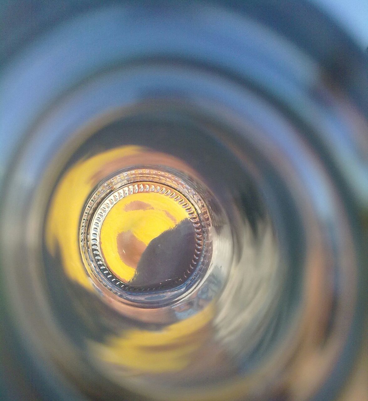 circle, indoors, close-up, full frame, reflection, motion, backgrounds, high angle view, geometric shape, pattern, abstract, blurred motion, no people, yellow, selective focus, water, illuminated, glass - material, transparent, spinning