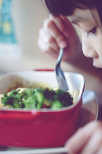 Close-up of woman holding ice cream in bowl