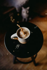 High angle view of coffee cup on table