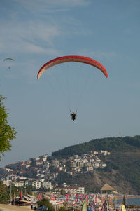 People paragliding in sky