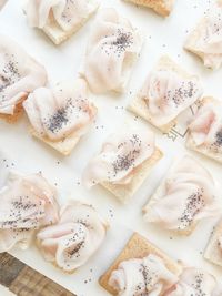 High angle view of bruschetta arranged on cutting board over table