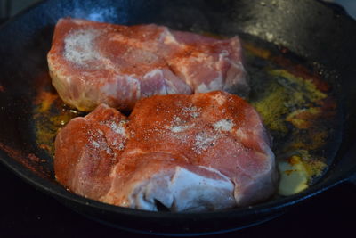 High angle view of meat in cooking pan