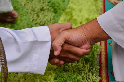 Close-up of people shaking hands