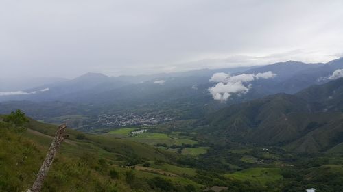 Scenic view of landscape and mountains against sky