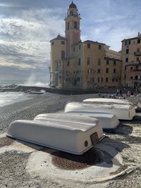 Built structure on beach against sky in city