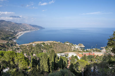 Aerial wide angle view of taormina and its beautiful coastline