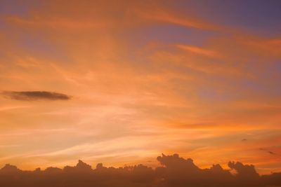 Low angle view of dramatic sky during sunset