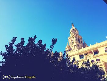 Low angle view of cathedral against clear blue sky