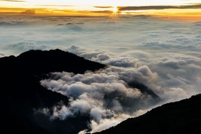 Scenic view of dramatic sky over sea during sunset