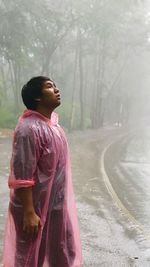 Side view of young man looking away