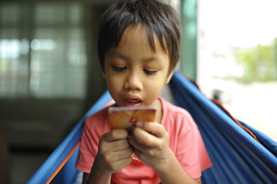 Boy holding card