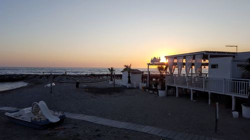 Scenic view of sea against clear sky during sunset