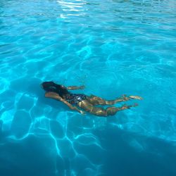 High angle view of woman swimming in pool