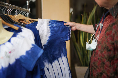 Midsection of woman holding rack