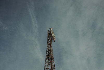 Low angle view of light tower against sky