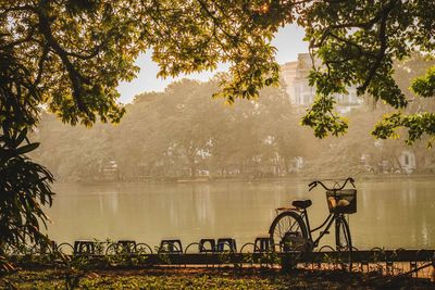 Bicycle by river in city