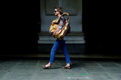 Full length of woman standing on floor at night