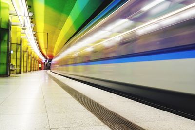 Blurred motion of train at railroad station