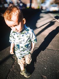 High angle view of cute baby on road