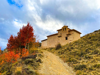 Historic building against sky during autumn