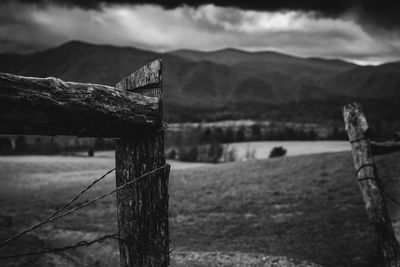 Close-up of old wooden fence on field