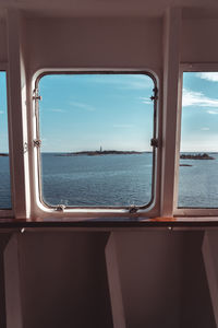 Scenic view of sea seen through window