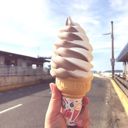 Hand holding ice cream cone