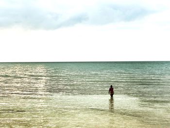 Man on sea against sky