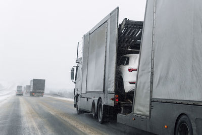 Cars on road against clear sky