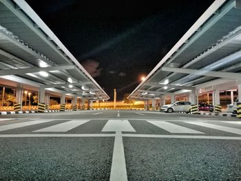 Illuminated road in city at night