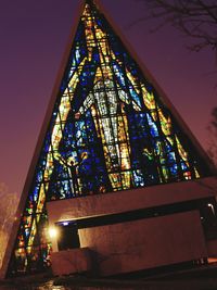 Low angle view of tower at night