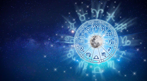 Digital composite image of clock against sky at night