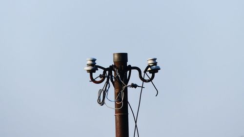 Low angle view of street light against clear sky