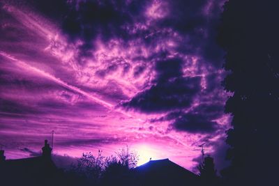Low angle view of dramatic sky during sunset